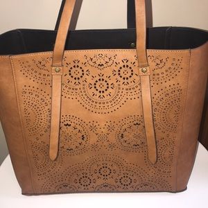 Brown tote bag with black interior.